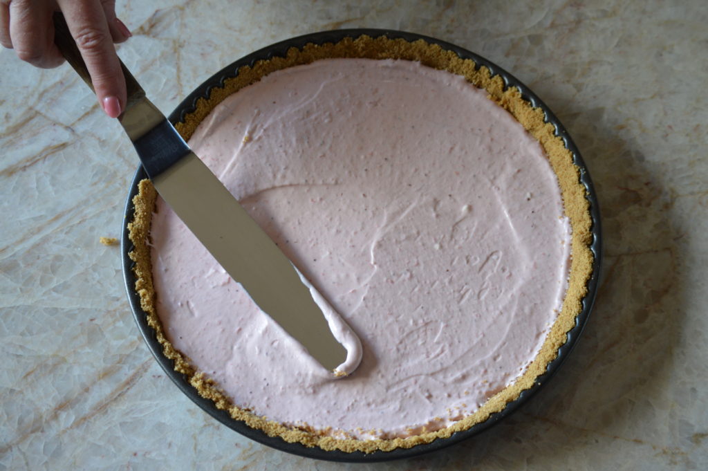 smoothing out the strawberry cheesecake tart