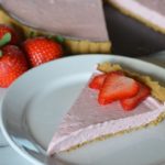 a slice of the strawberry cheesecake tart