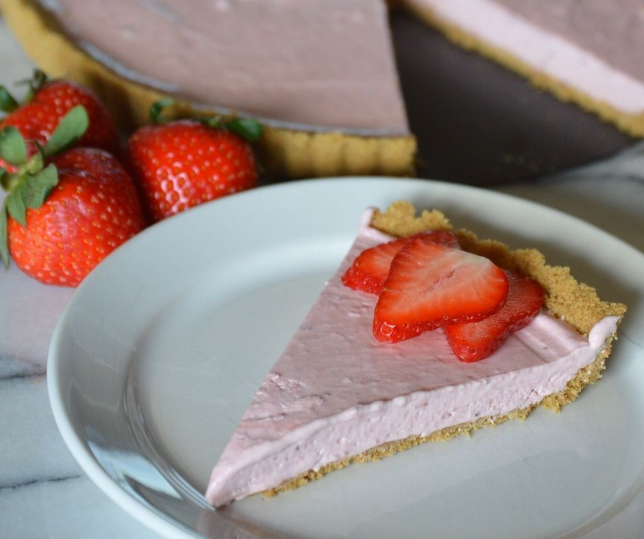 a slice of the strawberry cheesecake tart