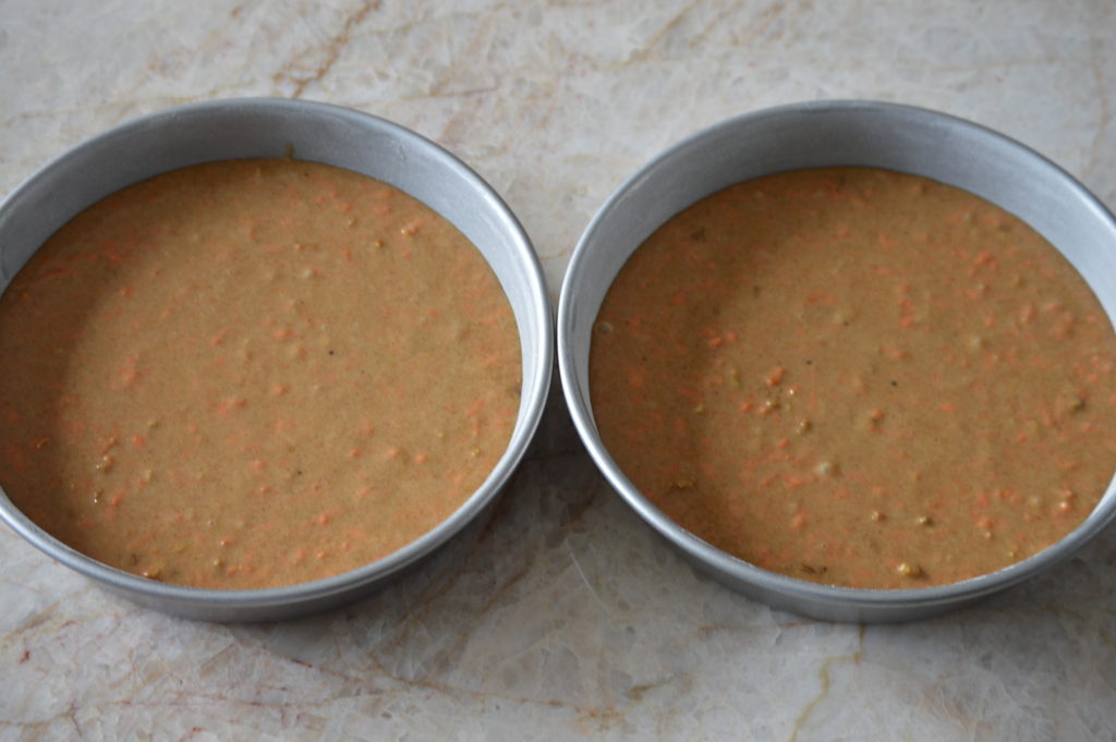 the batter is placed into two cake pans