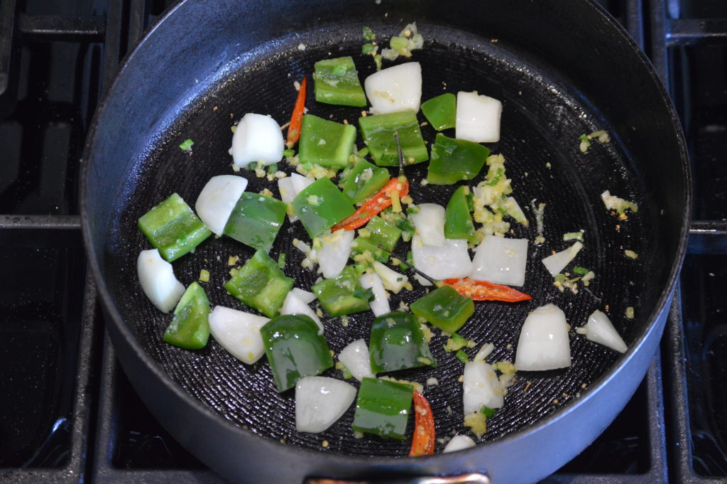 stir frying the vegetables and aromatics