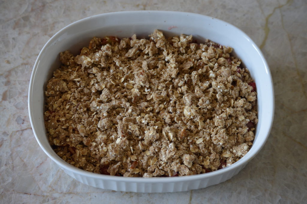 the topping is placed over the filling in a baking dish