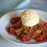 the finished strawberry rhubarb crisp with a scoop of ice cream on top