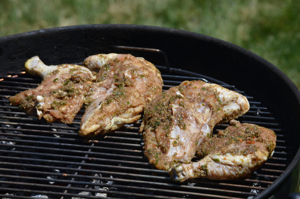 the chicken is skin side down on the grill