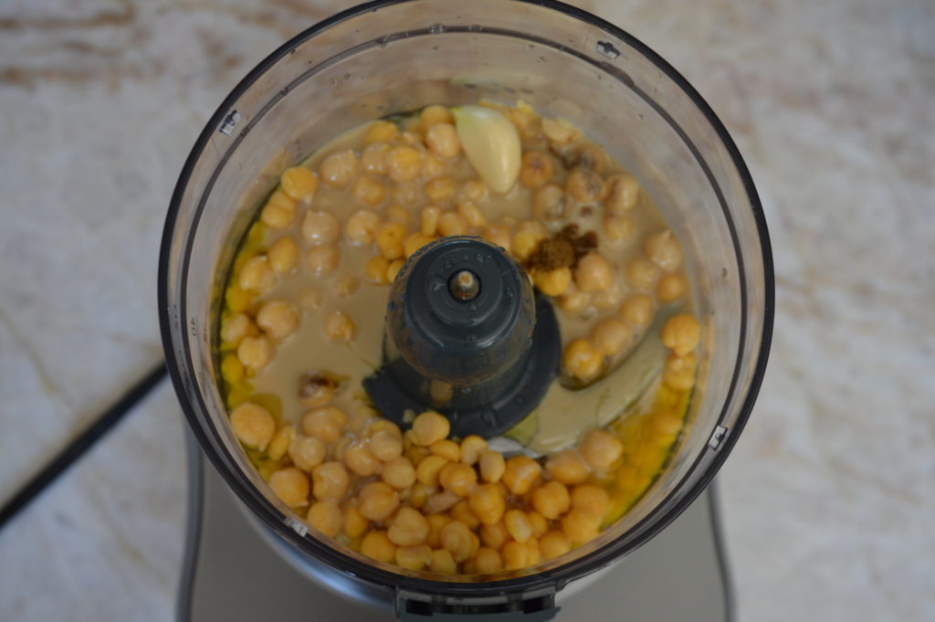 the ingredients for the hummus in a food processor
