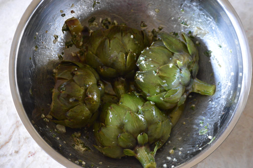 marinating the artichokes