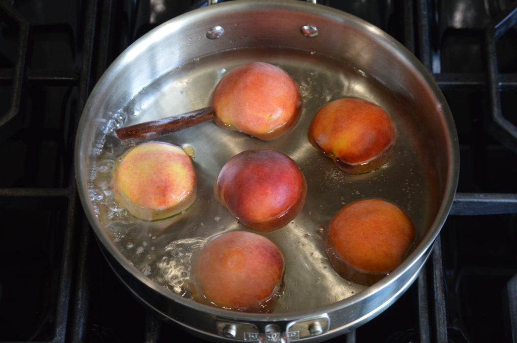 the peach halves are being poached