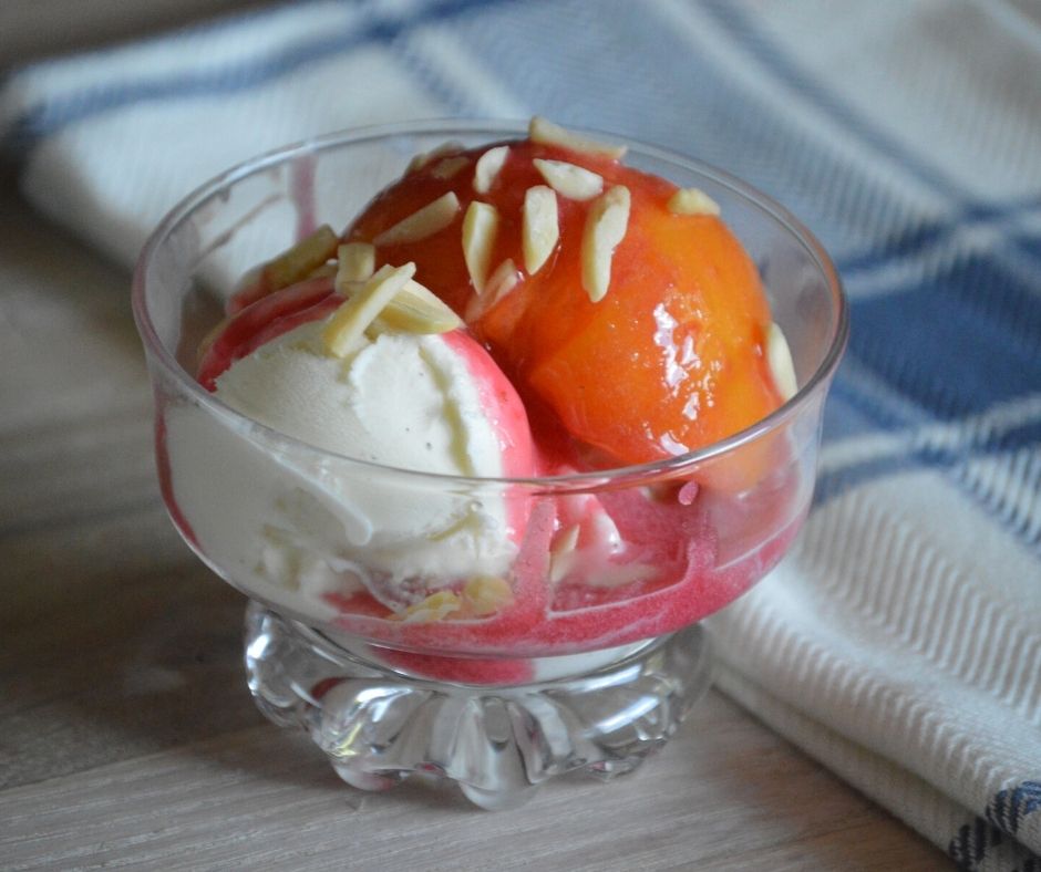 the finished peach melba in a bowl