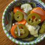 some of the finished jalapenos en escabeche in a bowl