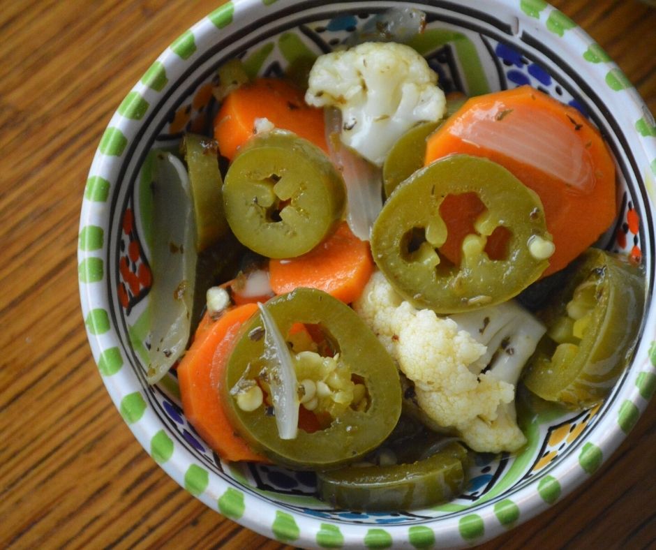 some of the finished jalapenos en escabeche in a bowl