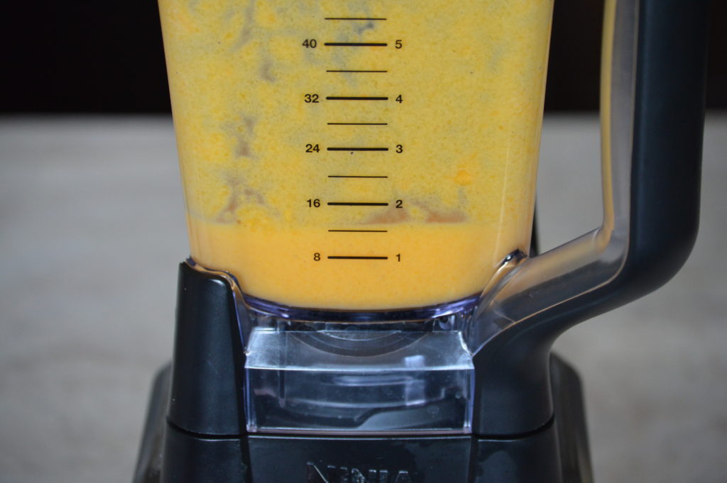 the mango and other ingredients are blended into a pulp