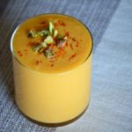 the finished mango lassi garnished with pistachio nuts