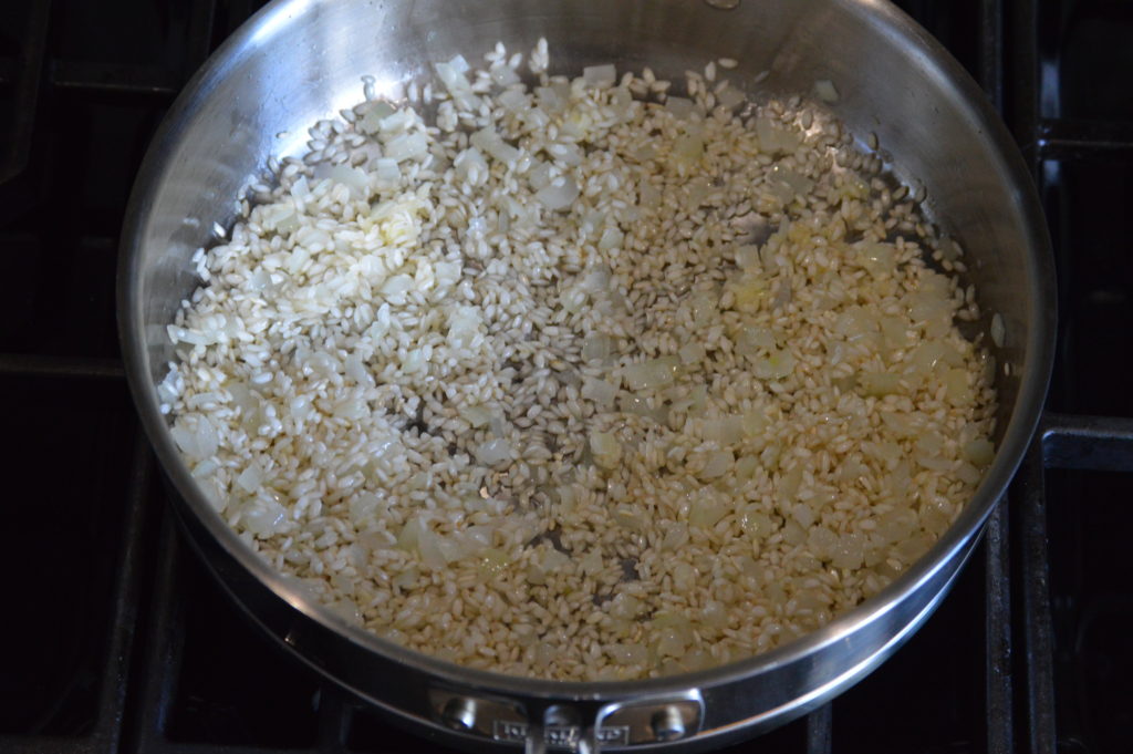 the onion, rice, and garlic is sautéed
