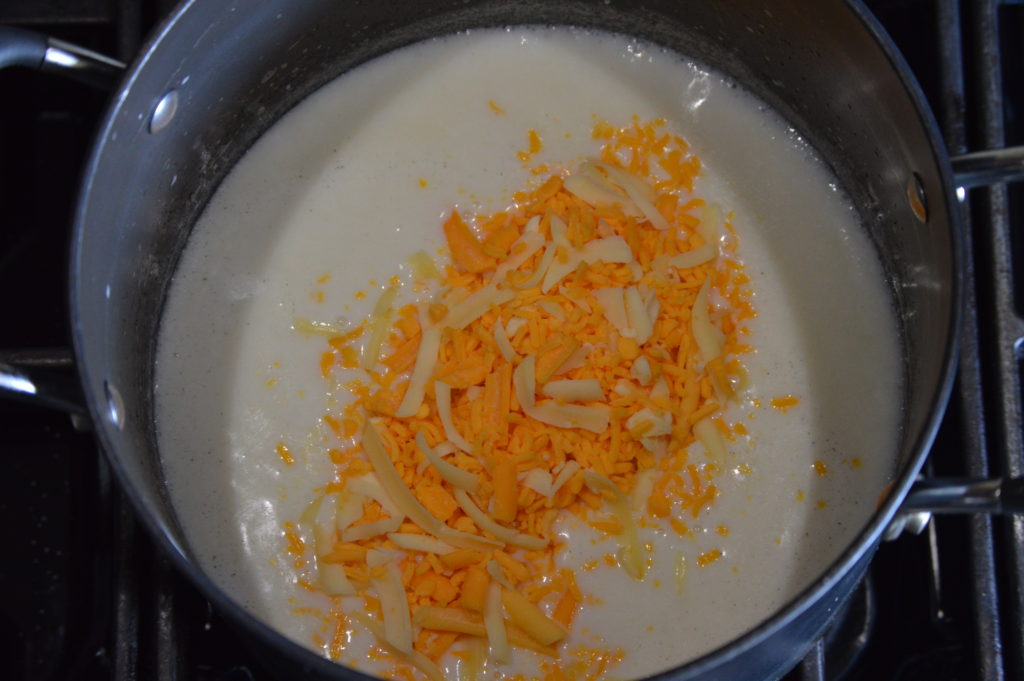 cheese is added to the béchamel sauce
