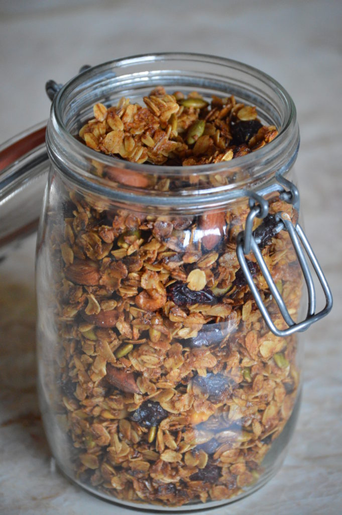 the finished granola in a glass jar