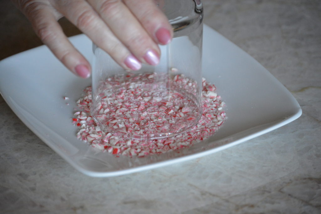 dipping rim into crushed candy canes