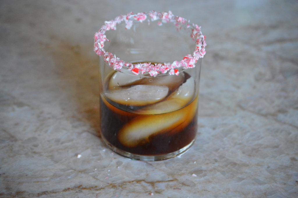 the vodka, schnapps, and Kahlua are poured into a glass with ice