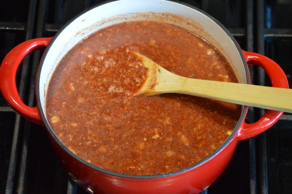 the ingredients for the chili mixed together in a pot