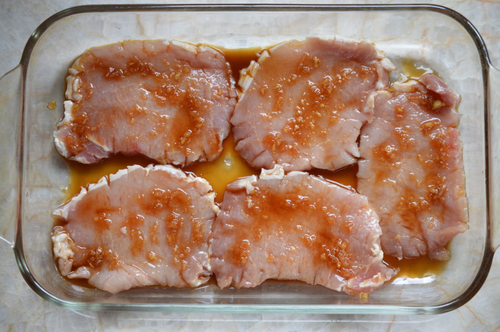 marinating the pork chops in the ginger sauce