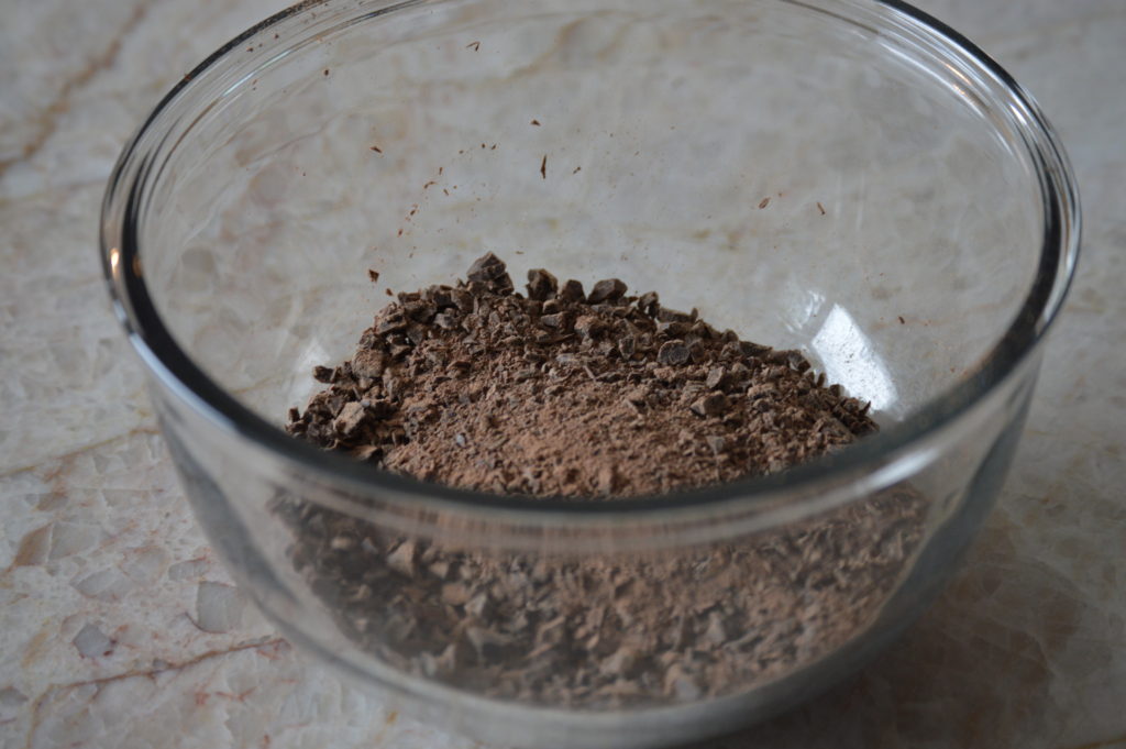 the chopped chocolate is set in a bowl