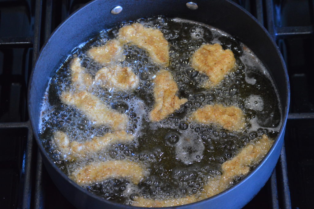 frying the chicken for our spice bag