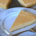 a slice of the dulce de leche cheesecake tart