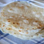 a stack of the finished flour tortillas
