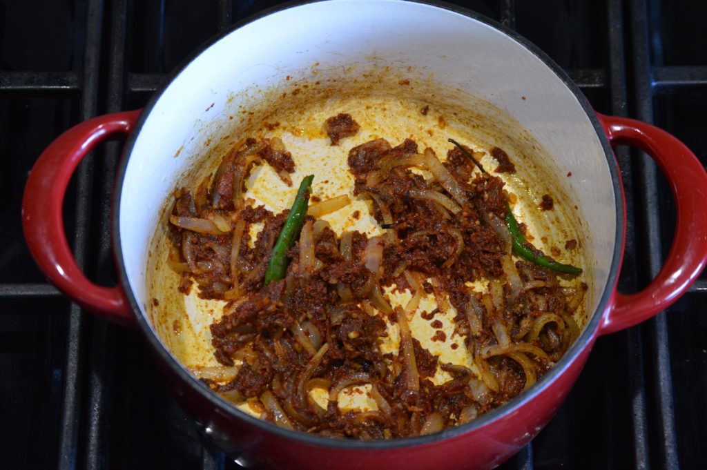 the remaingin spices, tomato paste, and aromatics are added