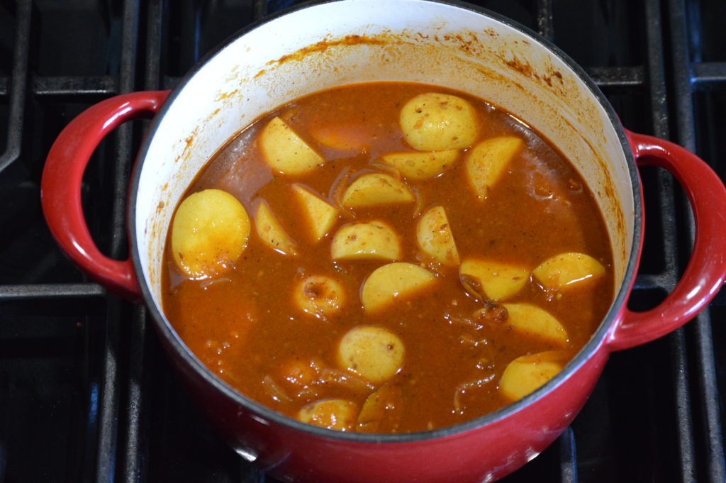the potatoes (aloo) are added