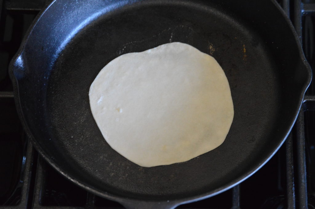 cooking the flour tortilla on one side
