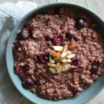a bowl of the finished almond cherry oatmeal