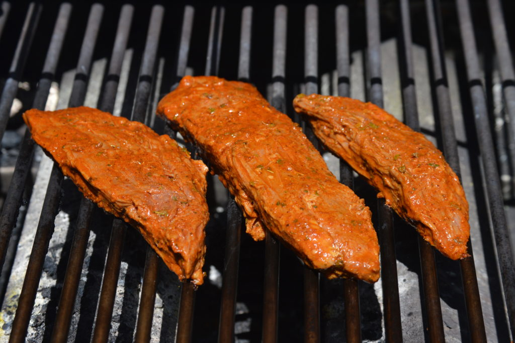 cooking the steaks on one side