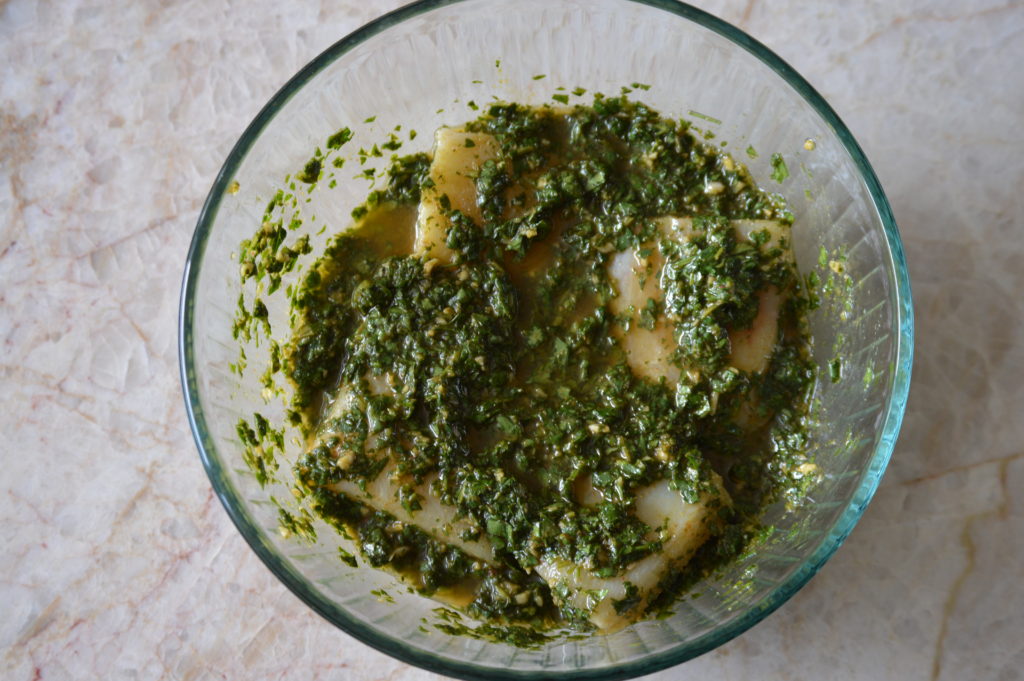 the cod is marinating in the chermoula sauce