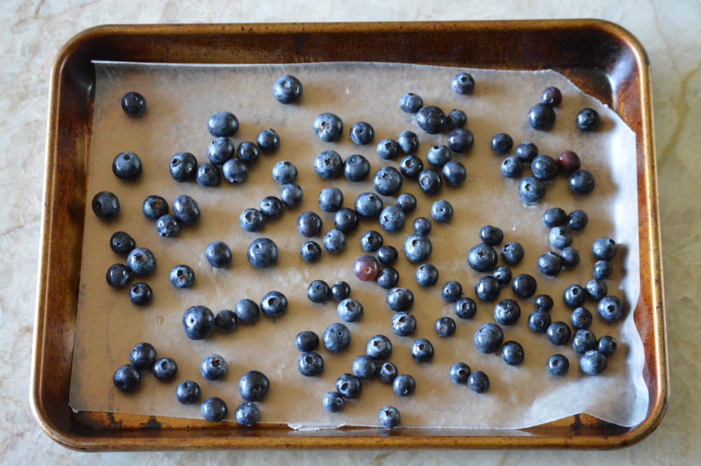 layering our blueberries out on a baking sheet
