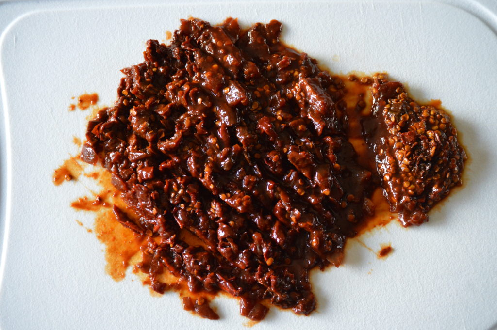 chopping up chipotle peppers