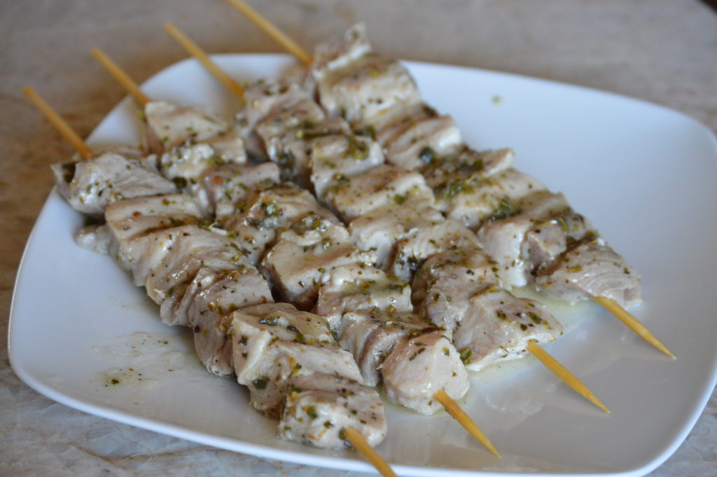 the pork souvlaki is on skewers and ready for grilling