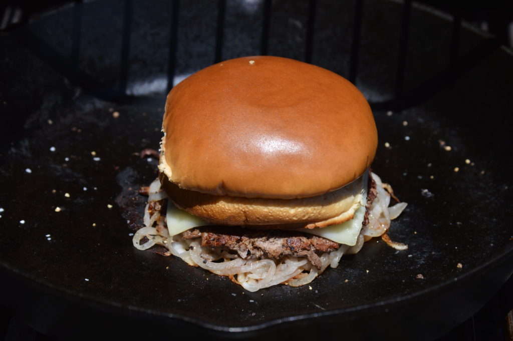the buns are placed on top of our oklahoma onion burger