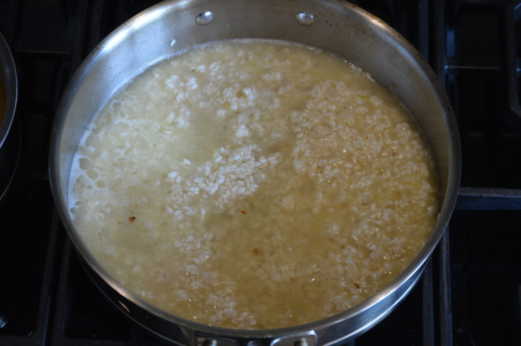 stock is added to the risotto rice