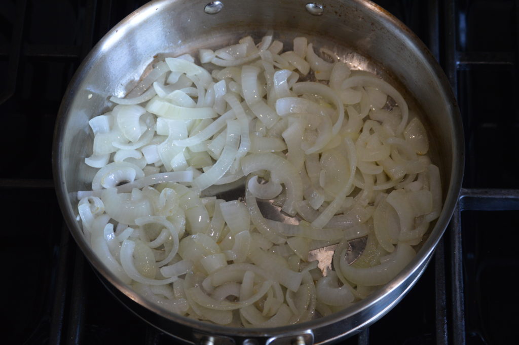 sautéing the sliced onion