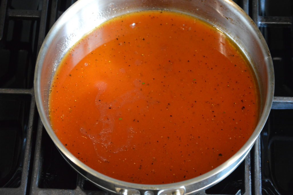 the olive oil and tomato based sauce is made