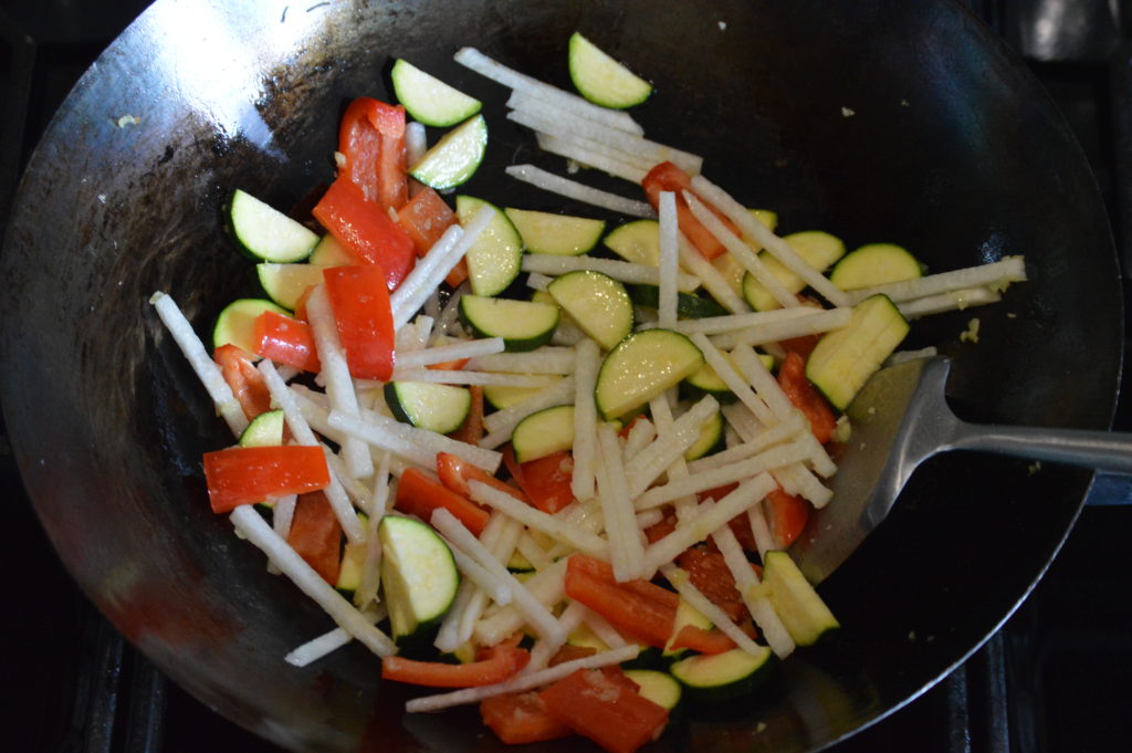 stir frying the harder vegetables