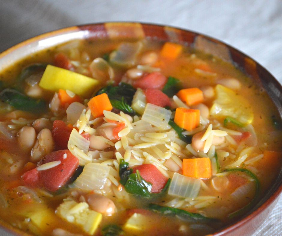 a bowl of the finished vegetable orzo soup