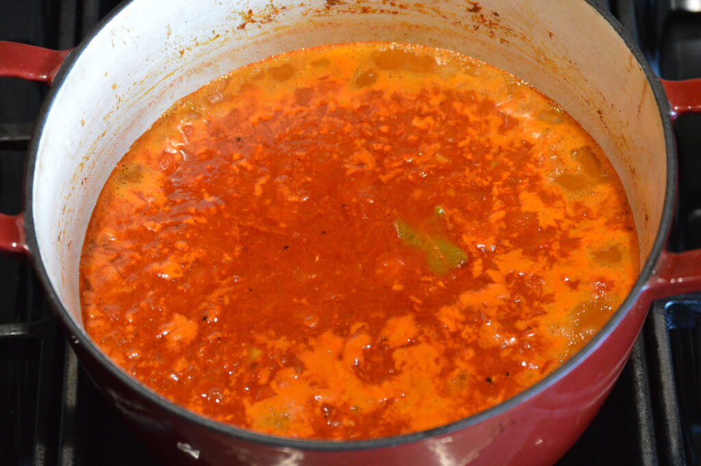 water is added and the goulash is let to simmer
