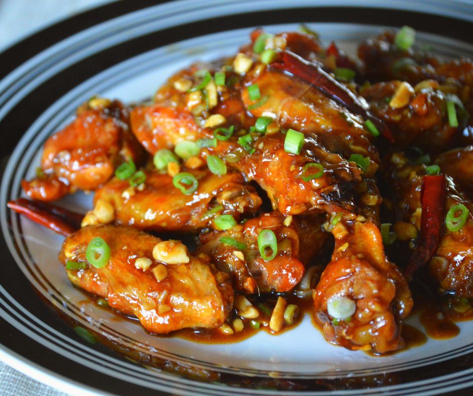 a plate of the finished kung pao chicken wings