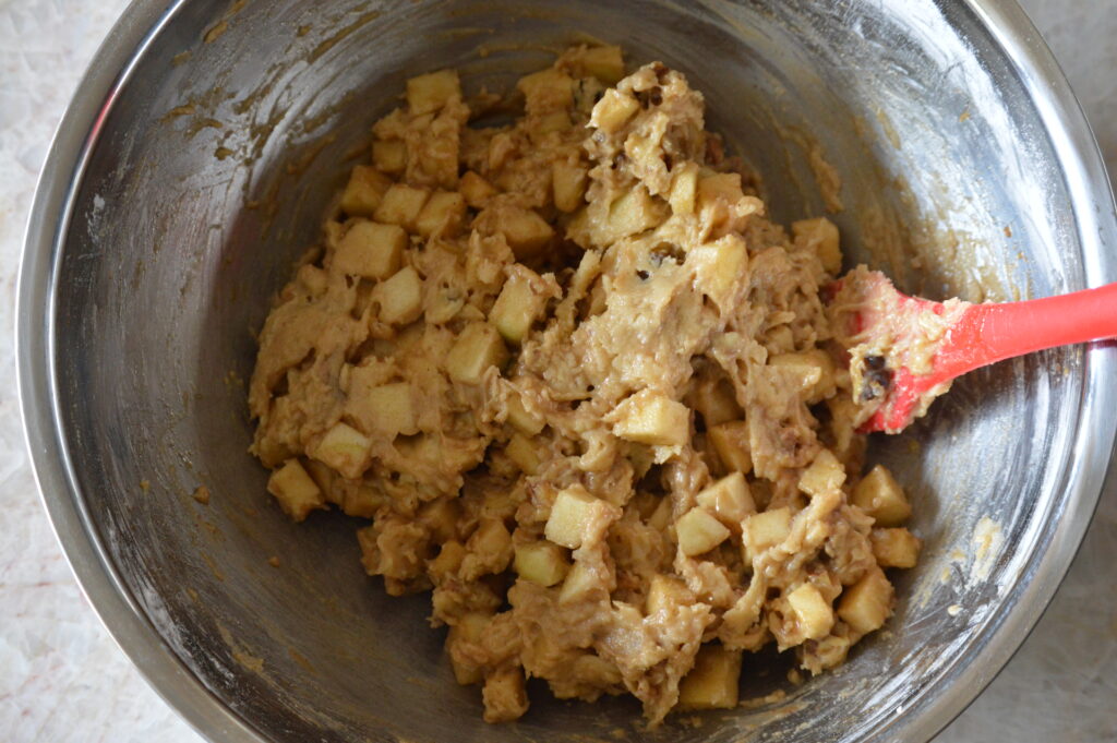 the apple mixture is mixed into the batter