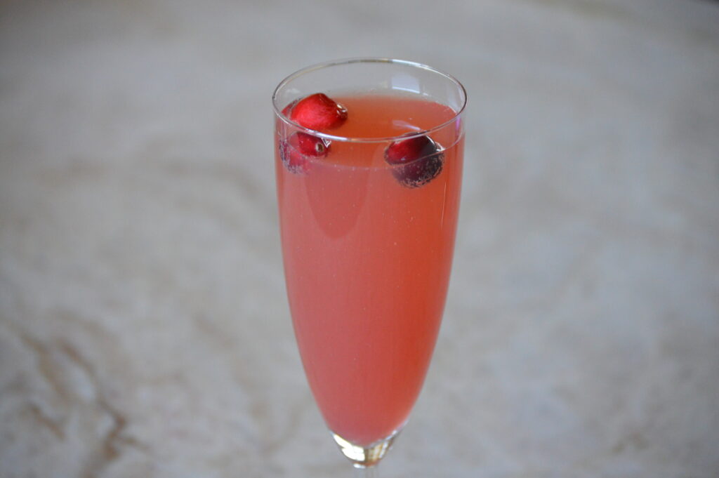the cranberry mimosa is garnished and ready to drink