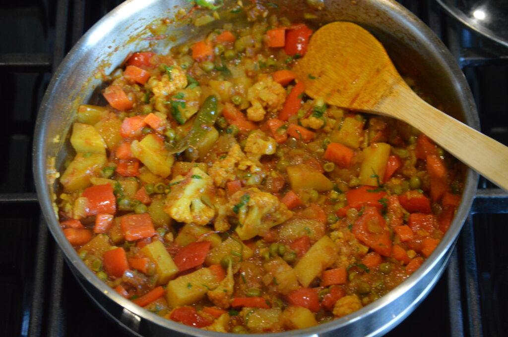 finishing the mixed vegetable curry