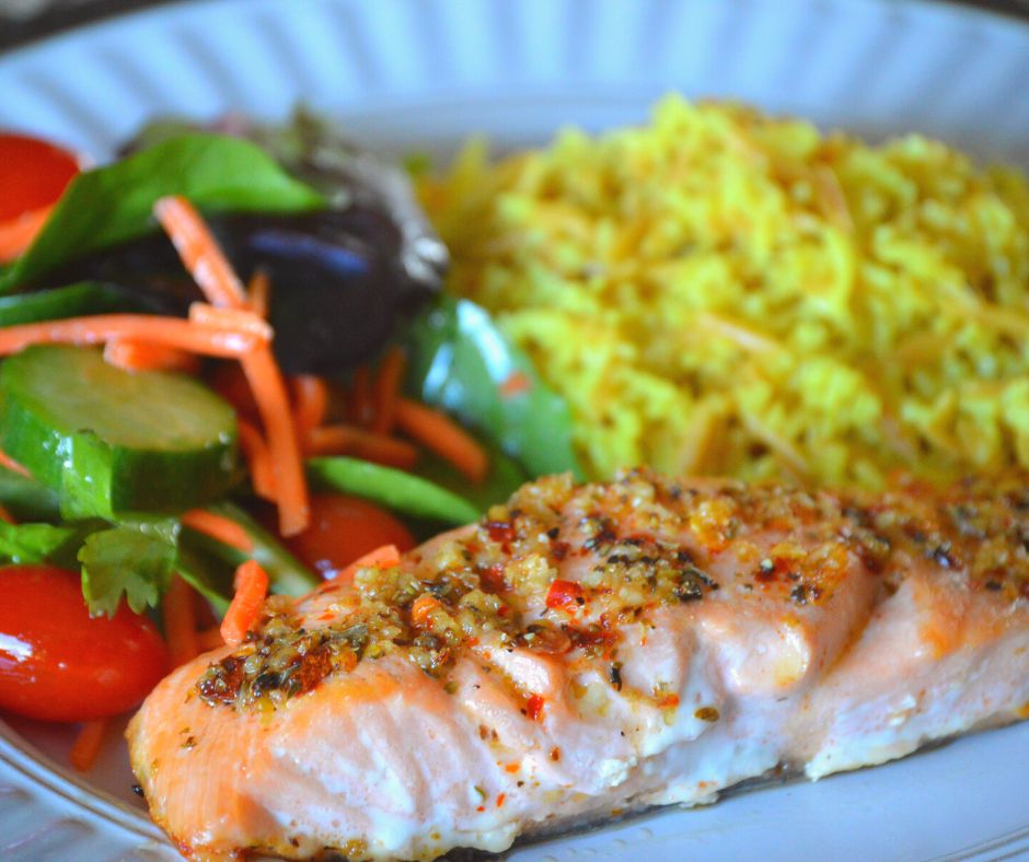 the finished greek salmon with rice and salad
