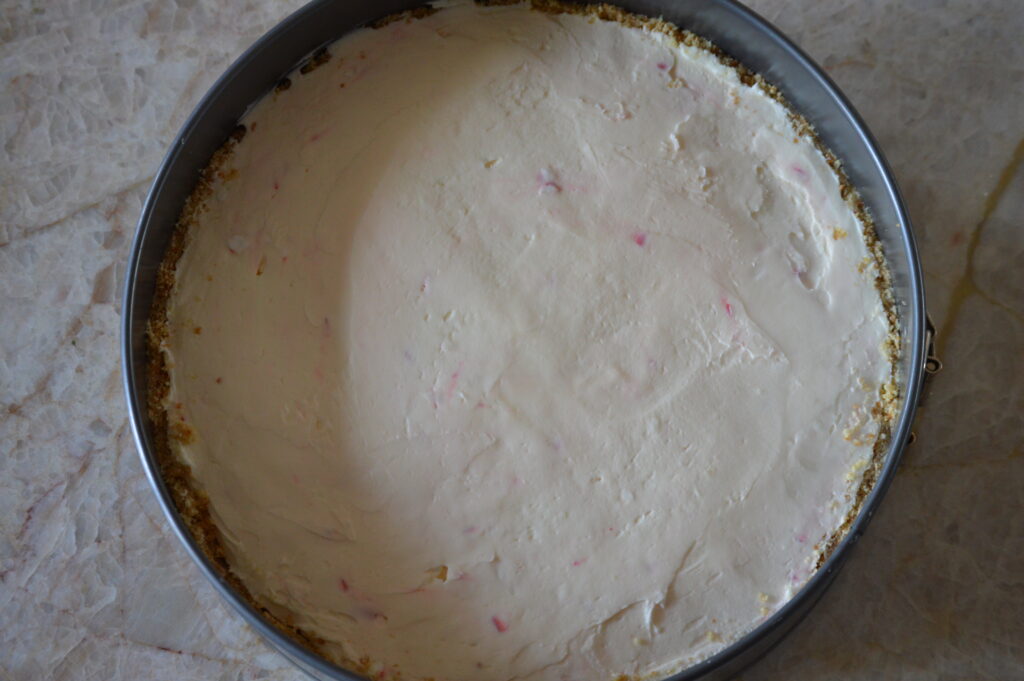 the cheesecake filling is spread within the crust
