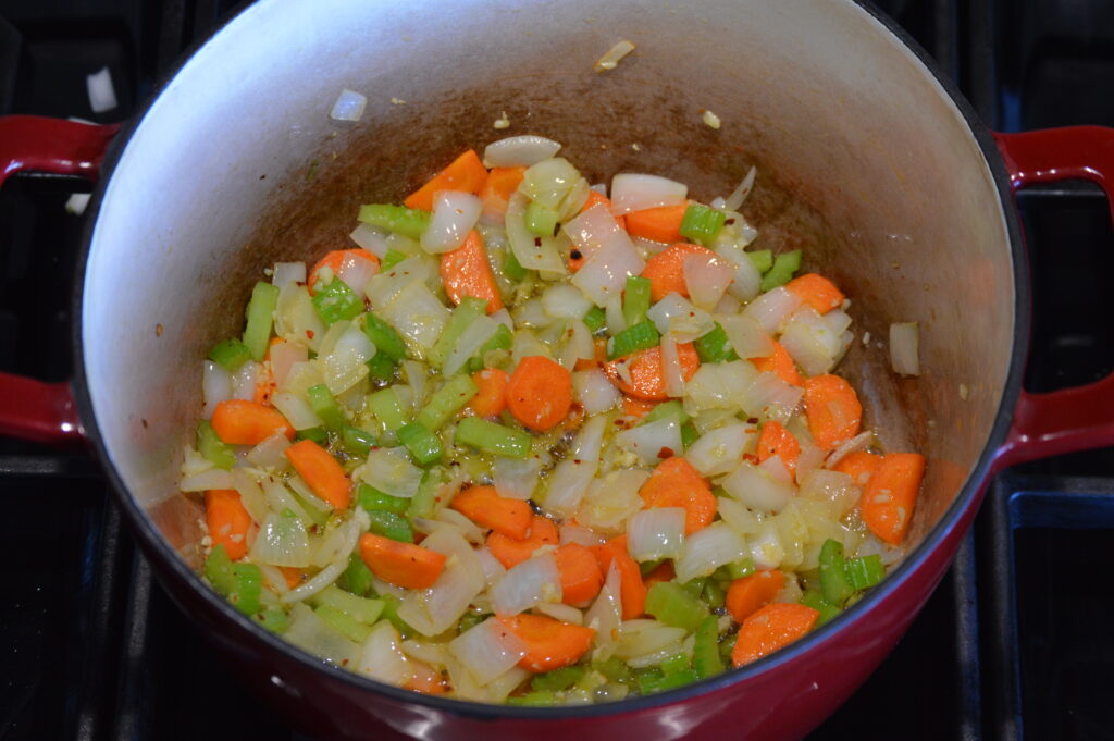 sautéing vegetables in a pot